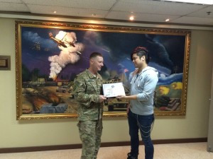 140 - William receiving a gratitude plaque from the Base Commander in SW Asia