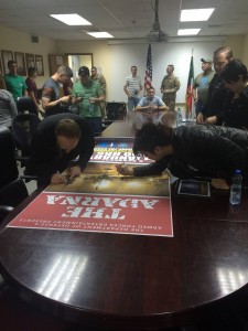 196 - Signing  posters for the officers at Camp Beuhring, Kuwait.