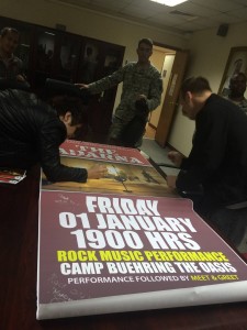 197- Signing  posters for the officers at Camp Buehring, Kuwait.